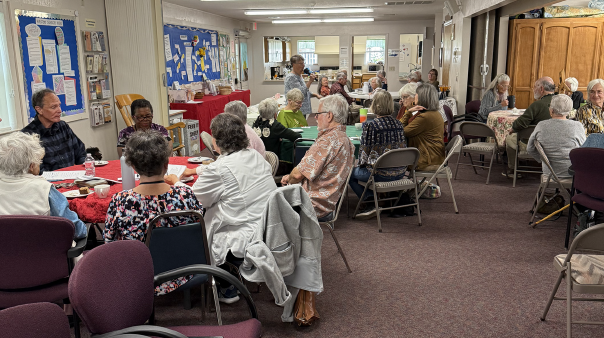 Members of the congregation seated together in the hall for a discussion